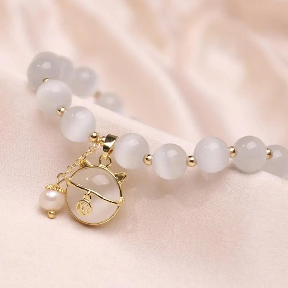 Bransoletka z koralikami i zawieszką szczęśliwego kota