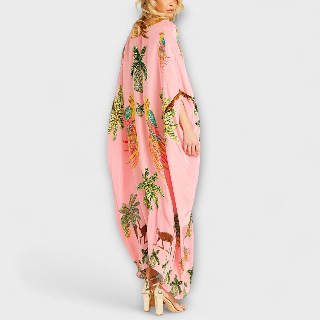Linda - Imponująca sukienka z asymetrycznymi ramiączkami i nadrukiem kokosowych palm